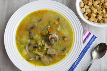 Cheese soup with broccoli and mushrooms
