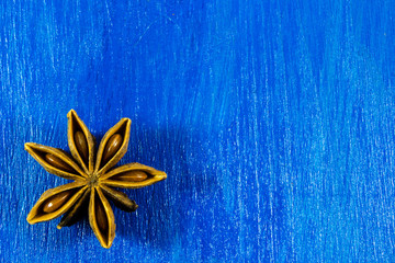 Star anise on wooden background