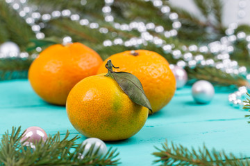 Tangerines, baubles and fir-tree cones