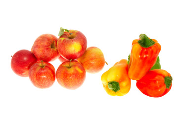 Red ripe apples and sweet pepper on a white background