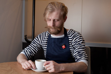 Handsome bearded man in cafe