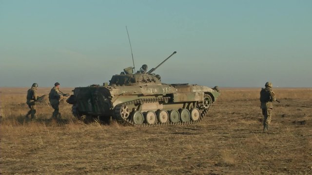Infantry fighting vehicle on the batlefield. Military armored vehicles training