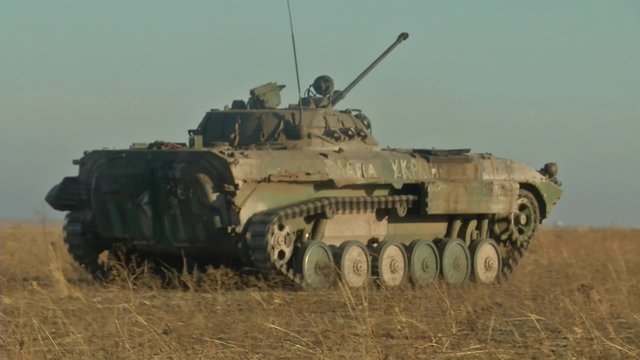 Infantry fighting vehicle on the batlefield. Military armored vehicles training