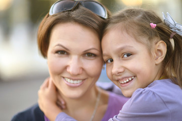 girl with mother in park