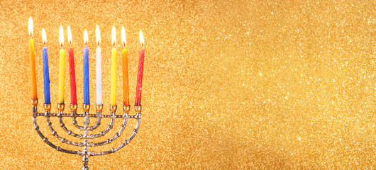 website banner image of of jewish holiday Hanukkah with menorah (traditional Candelabra). retro filtered.