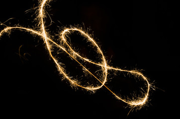 sparkler light trail in dark environment using slow shutter speed