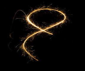 sparkler light trail in dark environment using slow shutter speed