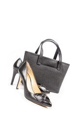 Black Leather Stilettos Shoes and Handbag Isolated on White