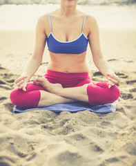 Yoga woman on sea coast