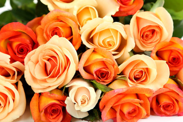 Bouquet of orange roses background, close up