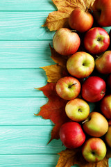Ripe apples on a mint wooden table