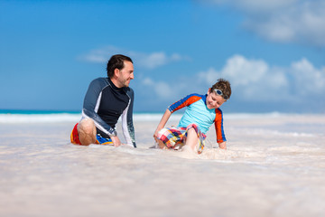 Fototapeta na wymiar Father with son at beach