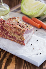 Smoked Meat with Vegetables on Brown Wooden Table