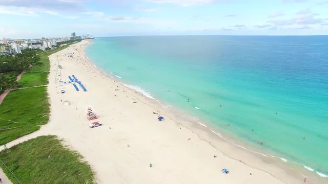 Aerial 4K video of South Beach, Miami Beach. Amazing bird's view on most famous beach in the World and South Pointe Park.