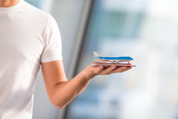 Closeup passports and boarding pass at airport indoor background airplane