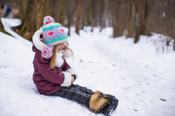 Adorable little girl during winter vacation outdoors