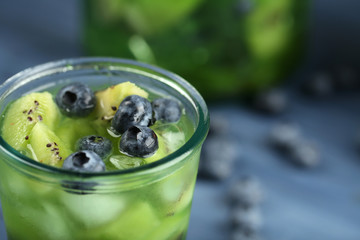 Kiwi and Blueberry cocktail on wooden background