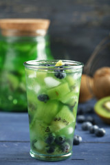 Kiwi and Blueberry cocktail on wooden background