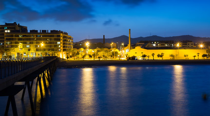 Fototapeta premium pier at beach of Badalona in evening