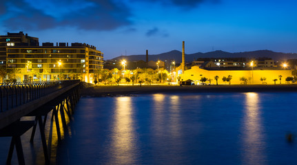 pier at beach of Badalona  in evening