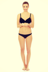 Woman in bikini with empty hands.