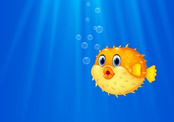 Cartoon funny puffer fish swimming in the ocean © tigatelu