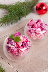 Christmas vegetable Salad, decorated mint in wineglass and fir b