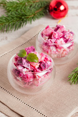 Christmas vegetable Salad in wineglass and fir branches