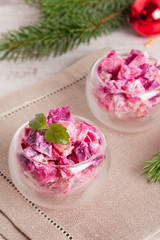 Christmas vegetable Salad, decorated mint in wineglass and fir b