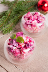 vegetable Salad in wineglass and fir branches