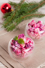 Christmas vegetable Salad in wineglass and fir branches