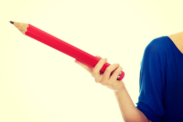 Woman pointing with pencil.