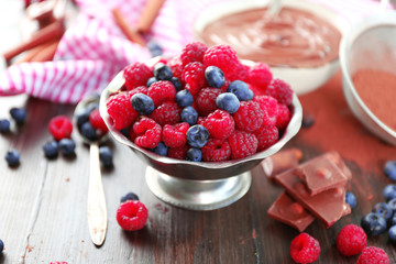 Beautiful composition with chocolate cream and ripe berries