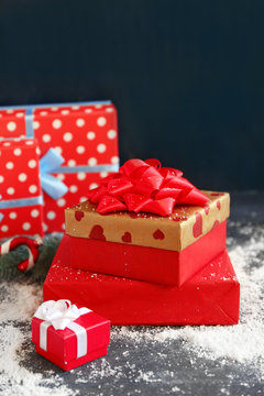 Christmas gifts on color wooden background