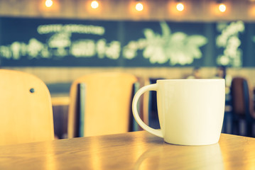 White coffee cup in coffee shop cafe