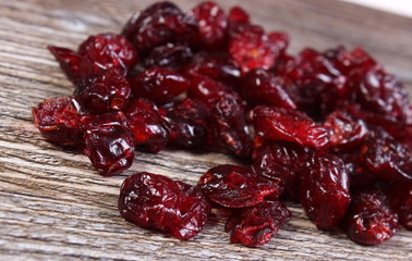 Heap of red cranberries on wooden table