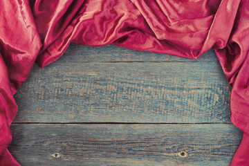 Red cloth on a wooden board
