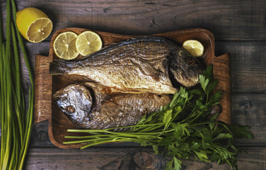 On a wooden table plate with two roasted