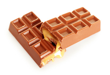 Tasty broken chocolate bars isolated on white background