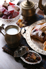 Antique tea-set with Turkish delight and baking on table close-up
