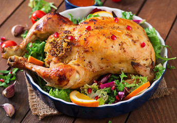 Baked chicken stuffed with rice for Christmas dinner on a festive table