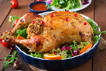 Baked chicken stuffed with rice for Christmas dinner on a festive table