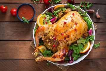 Baked chicken stuffed with rice for Christmas dinner on a festive table