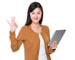 Young Woman hold with tablet and ok sign gesture