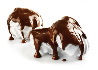Chocolate poured on marshmallow isolated on white