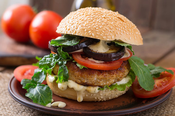 Juicy spicy chicken burgers with tomato and eggplant - sandwich.