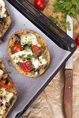 delicious bruschetta with tomatoes, cheese and mushrooms