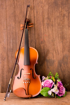 Vintage composition with violin and flower