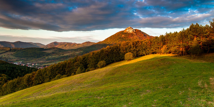 Autumn forrest with dramatic cloudy sky. Vapec hill, Strazovske vrchy, Slovakia