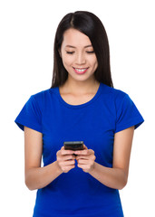 Young Woman play with the smart phone